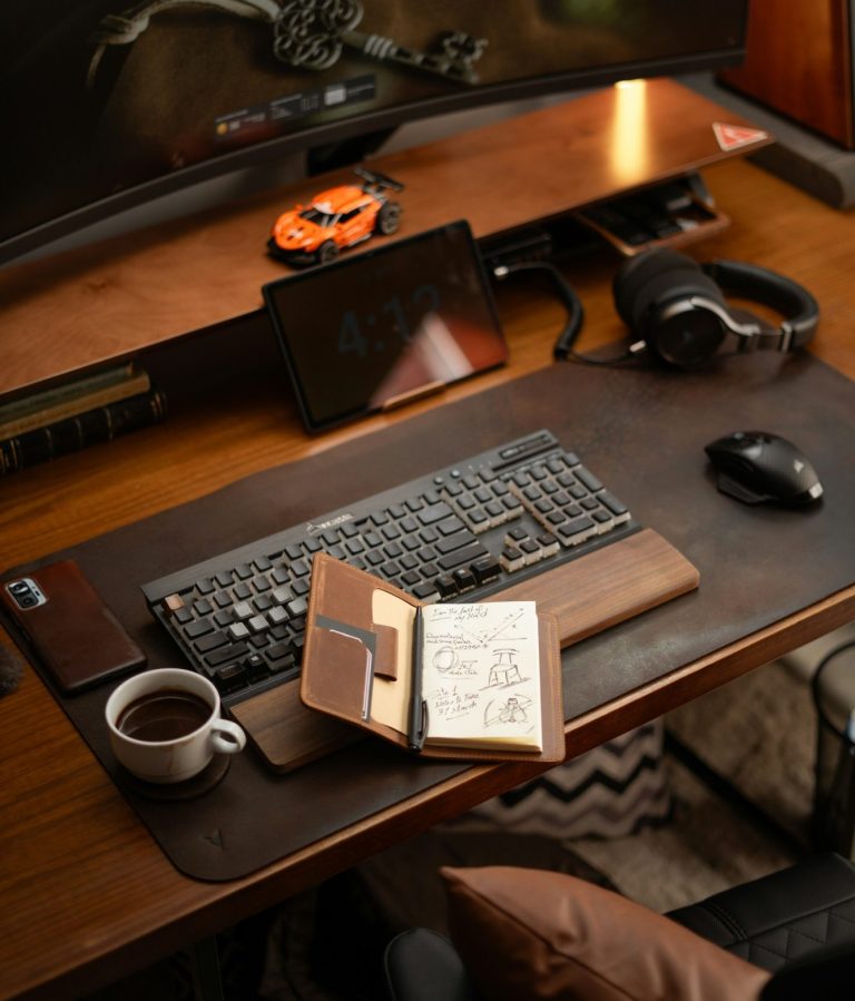 Business advisory workspace with computer open diary and coffee representing strategic financial guidance and consulting from Hayes & Co