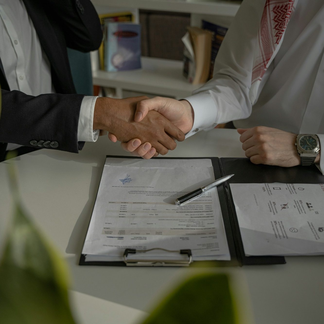 Business advisor shaking hands with client representing trusted strategic advisory partnership and consulting relationship with Hayes & Co 